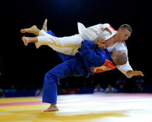 England's Danny Williams (blue) throws Connor Ireland of Wales as Williams wins his 73kG Preliminary Round in the Judo at the SECC during the 2014 Commonwealth Games in Glasgow. PRESS ASSOCIATION Photo. Picture date: Friday July 25, 2014. See PA story COMMONWEALTH Judo. Photo credit should read: John Giles/PA Wire. RESTICTIONS: Editorial use only. No commercial use. No video emulation.